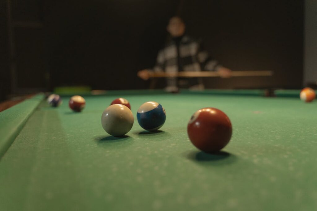 Billiard balls on green pool table cloth showing quality cloth texture