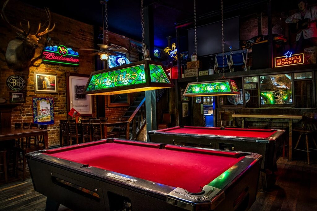 Close-up of pool cue tips on a billiard table