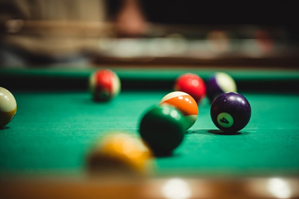 Close-up of pool balls on a billiard table during competition