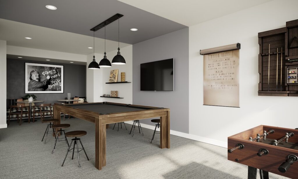Modern home game room with a pool table and stylish seating area