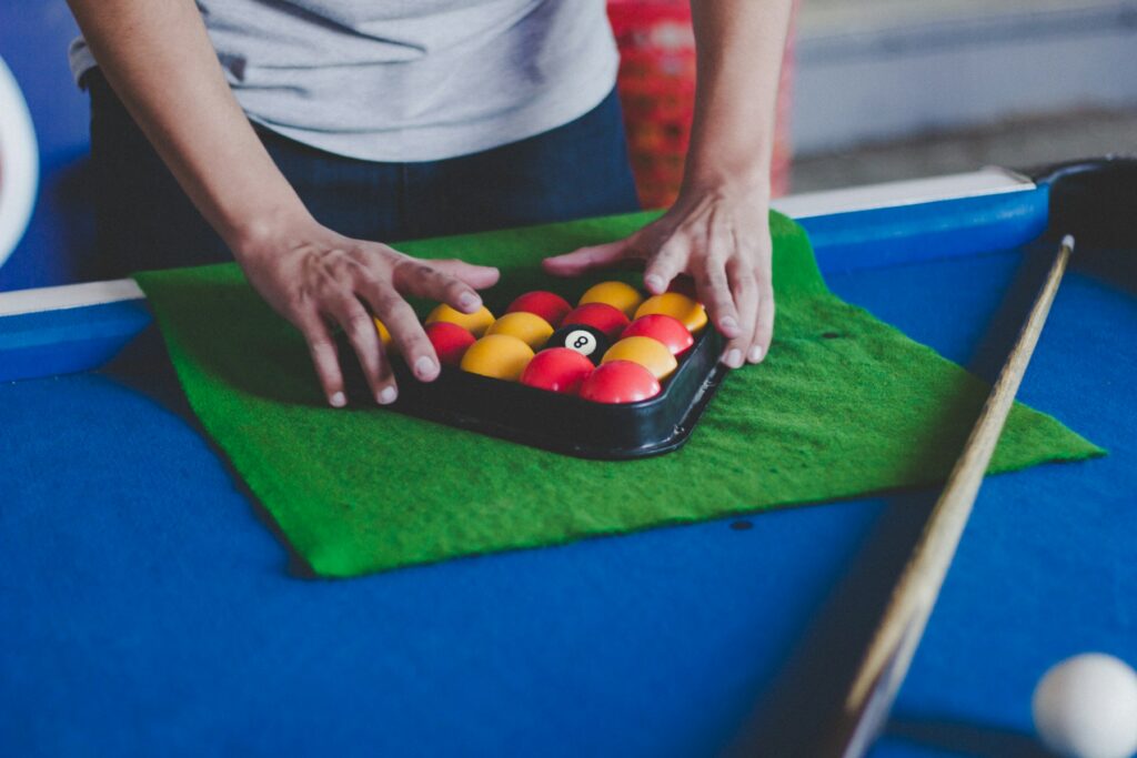 Professional woman pool player during a tense tournament match